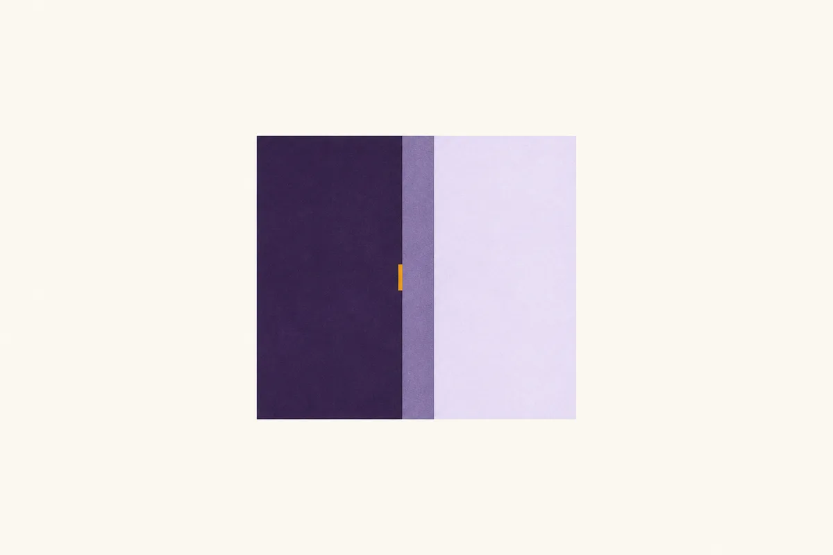 A rectangle split into a dark purple half and a pale lavender half, with a small amber marker sitting on the dividing line.